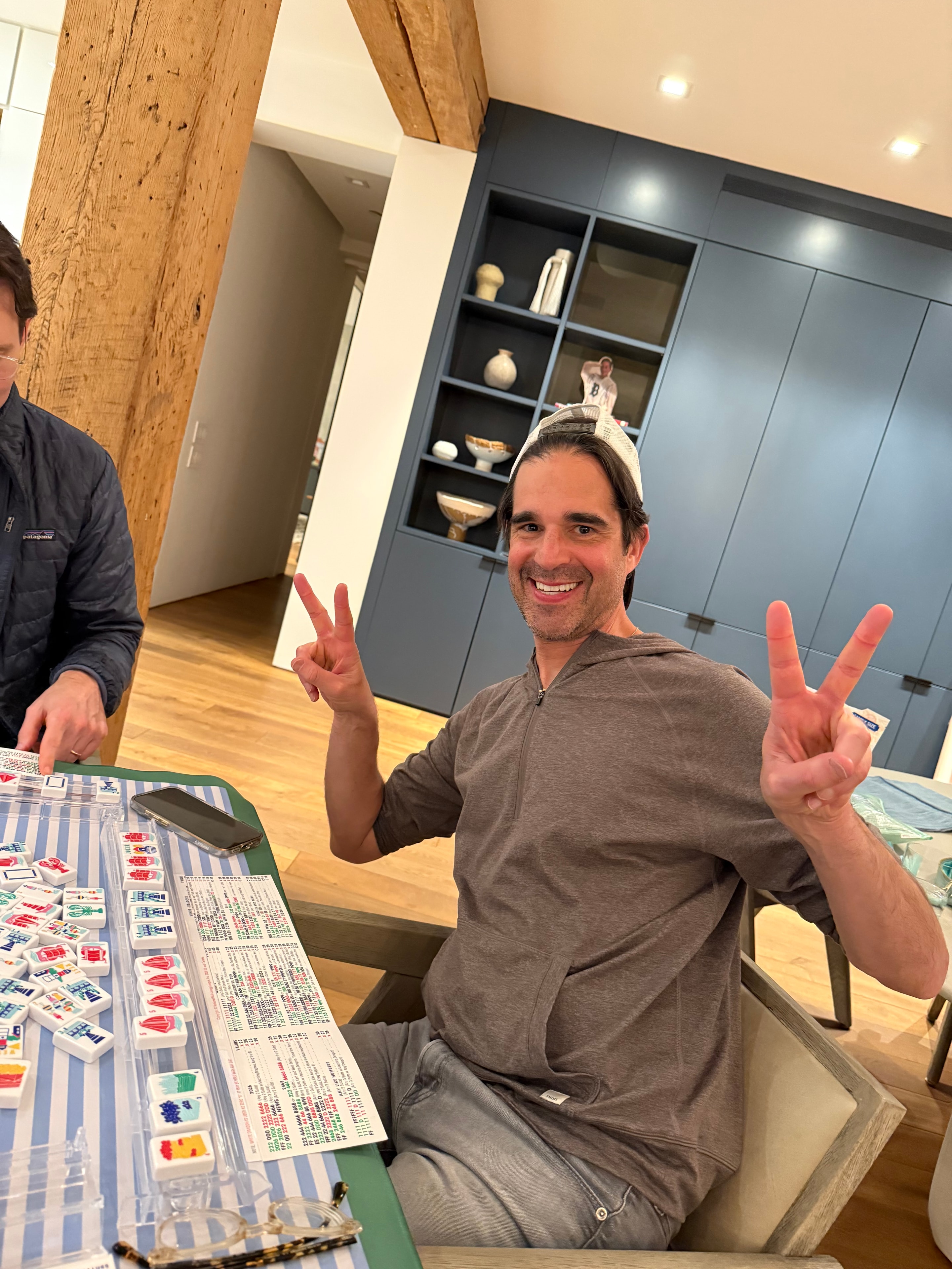 Friends gathered at an outdoor mahjong event